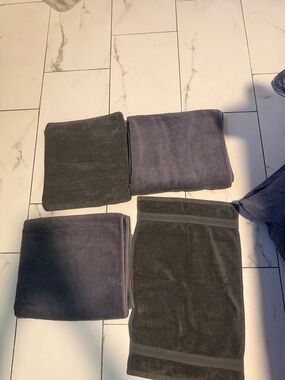 Set of Folded Dark Gray and Charcoal Towels